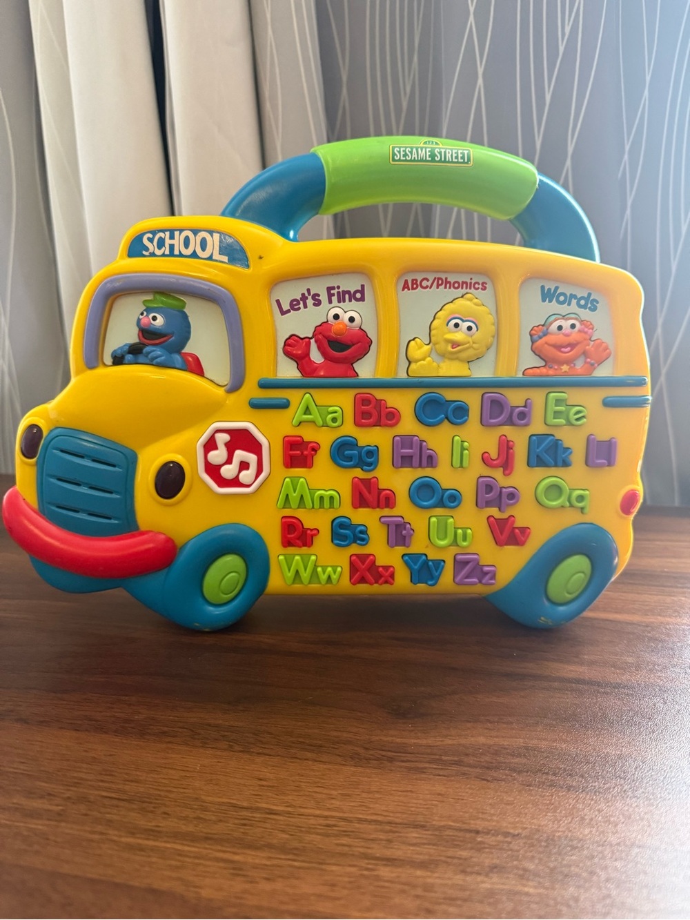 Sesame Street Yellow School Bus ABC Learning Toy with Blue & Green Handle